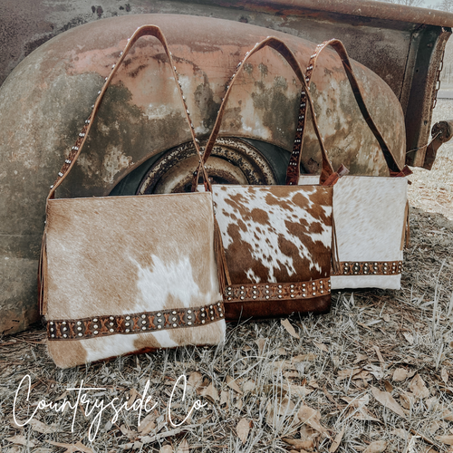 {{ brindle_boutique }} {{ online_boutique }} {{ jeans}} {{ brindle boutique }} {{ handbags }} {{ Native American jewelry }} {{ jewelry }} {{ cowhide}} {{ leather handbag}} {{ cowhide purse}} {{ turquoise}} {{ Navajo pearls }} {{ sterling silver}} {{ sterling silver pearls }} {{ necklace }} {{ bracelet }} {{ earrings }} {{ pendants }} {{ Navajo }} {{ cowhide tote }} {{ jeans }} {{ kan can }} {{ haute southern hyde }} {{ countryside co. }} {{ western }}