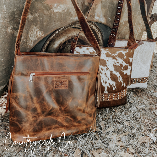 {{ brindle_boutique }} {{ online_boutique }} {{ jeans}} {{ brindle boutique }} {{ handbags }} {{ Native American jewelry }} {{ jewelry }} {{ cowhide}} {{ leather handbag}} {{ cowhide purse}} {{ turquoise}} {{ Navajo pearls }} {{ sterling silver}} {{ sterling silver pearls }} {{ necklace }} {{ bracelet }} {{ earrings }} {{ pendants }} {{ Navajo }} {{ cowhide tote }} {{ jeans }} {{ kan can }} {{ haute southern hyde }} {{ countryside co. }} {{ western }}