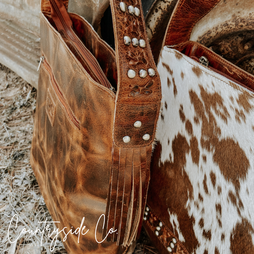 {{ brindle_boutique }} {{ online_boutique }} {{ jeans}} {{ brindle boutique }} {{ handbags }} {{ Native American jewelry }} {{ jewelry }} {{ cowhide}} {{ leather handbag}} {{ cowhide purse}} {{ turquoise}} {{ Navajo pearls }} {{ sterling silver}} {{ sterling silver pearls }} {{ necklace }} {{ bracelet }} {{ earrings }} {{ pendants }} {{ Navajo }} {{ cowhide tote }} {{ jeans }} {{ kan can }} {{ haute southern hyde }} {{ countryside co. }} {{ western }}