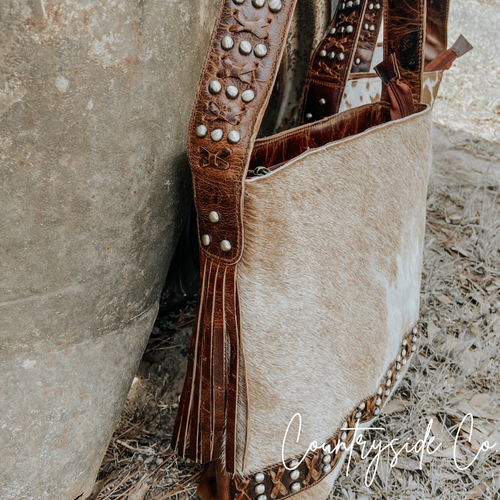 {{ brindle_boutique }} {{ online_boutique }} {{ jeans}} {{ brindle boutique }} {{ handbags }} {{ Native American jewelry }} {{ jewelry }} {{ cowhide}} {{ leather handbag}} {{ cowhide purse}} {{ turquoise}} {{ Navajo pearls }} {{ sterling silver}} {{ sterling silver pearls }} {{ necklace }} {{ bracelet }} {{ earrings }} {{ pendants }} {{ Navajo }} {{ cowhide tote }} {{ jeans }} {{ kan can }} {{ haute southern hyde }} {{ countryside co. }} {{ western }}