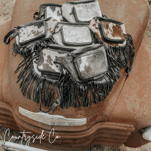 {{ brindle_boutique }} {{ online_boutique }} {{ jeans}} {{ brindle boutique }} {{ handbags }} {{ Native American jewelry }} {{ jewelry }} {{ cowhide}} {{ leather handbag}} {{ cowhide purse}} {{ turquoise}} {{ Navajo pearls }} {{ sterling silver}} {{ sterling silver pearls }} {{ necklace }} {{ bracelet }} {{ earrings }} {{ pendants }} {{ Navajo }} {{ cowhide tote }} {{ jeans }} {{ kan can }} {{ haute southern hyde }} {{ countryside co. }} {{ western }}
