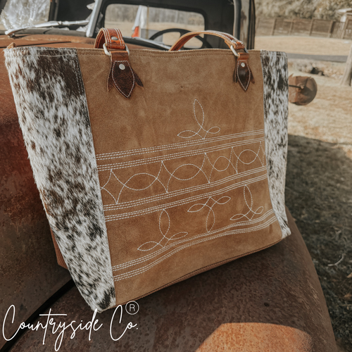 {{ brindle_boutique }} {{ online_boutique }} {{ jeans}} {{ brindle boutique }} {{ handbags }} {{ Native American jewelry }} {{ jewelry }} {{ cowhide}} {{ leather handbag}} {{ cowhide purse}} {{ turquoise}} {{ Navajo pearls }} {{ sterling silver}} {{ sterling silver pearls }} {{ necklace }} {{ bracelet }} {{ earrings }} {{ pendants }} {{ Navajo }} {{ cowhide tote }} {{ jeans }} {{ kan can }} {{ haute southern hyde }} {{ countryside co. }} {{ western }}