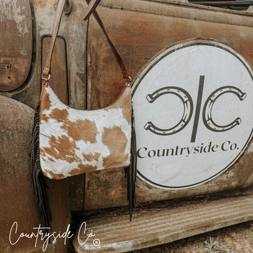 {{ brindle_boutique }} {{ online_boutique }} {{ jeans}} {{ brindle boutique }} {{ handbags }} {{ Native American jewelry }} {{ jewelry }} {{ cowhide}} {{ leather handbag}} {{ cowhide purse}} {{ turquoise}} {{ Navajo pearls }} {{ sterling silver}} {{ sterling silver pearls }} {{ necklace }} {{ bracelet }} {{ earrings }} {{ pendants }} {{ Navajo }} {{ cowhide tote }} {{ jeans }} {{ kan can }} {{ haute southern hyde }} {{ countryside co. }} {{ western }}